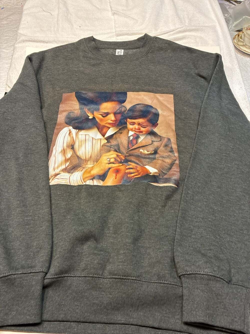 Lane Seven Graphic Print Sweatshirt Featuring Mother and Crying Son Art